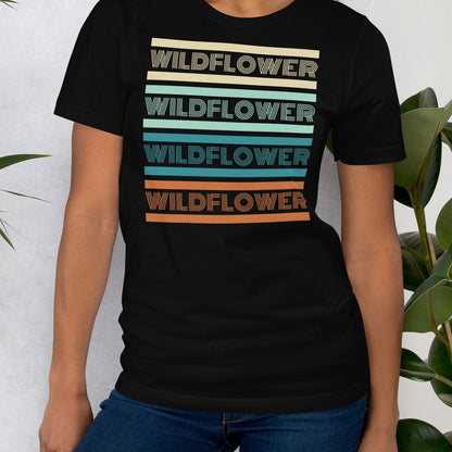 Black t-shirt with 'WILDFLOWER' text in colorful stripes.