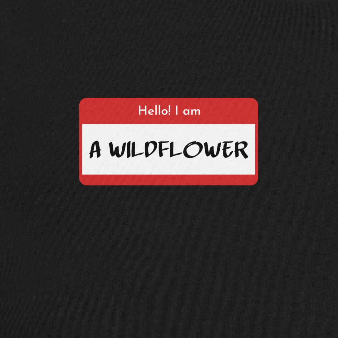 Black t-shirt with name tag and 'Hello! I am A Wildflower' text.