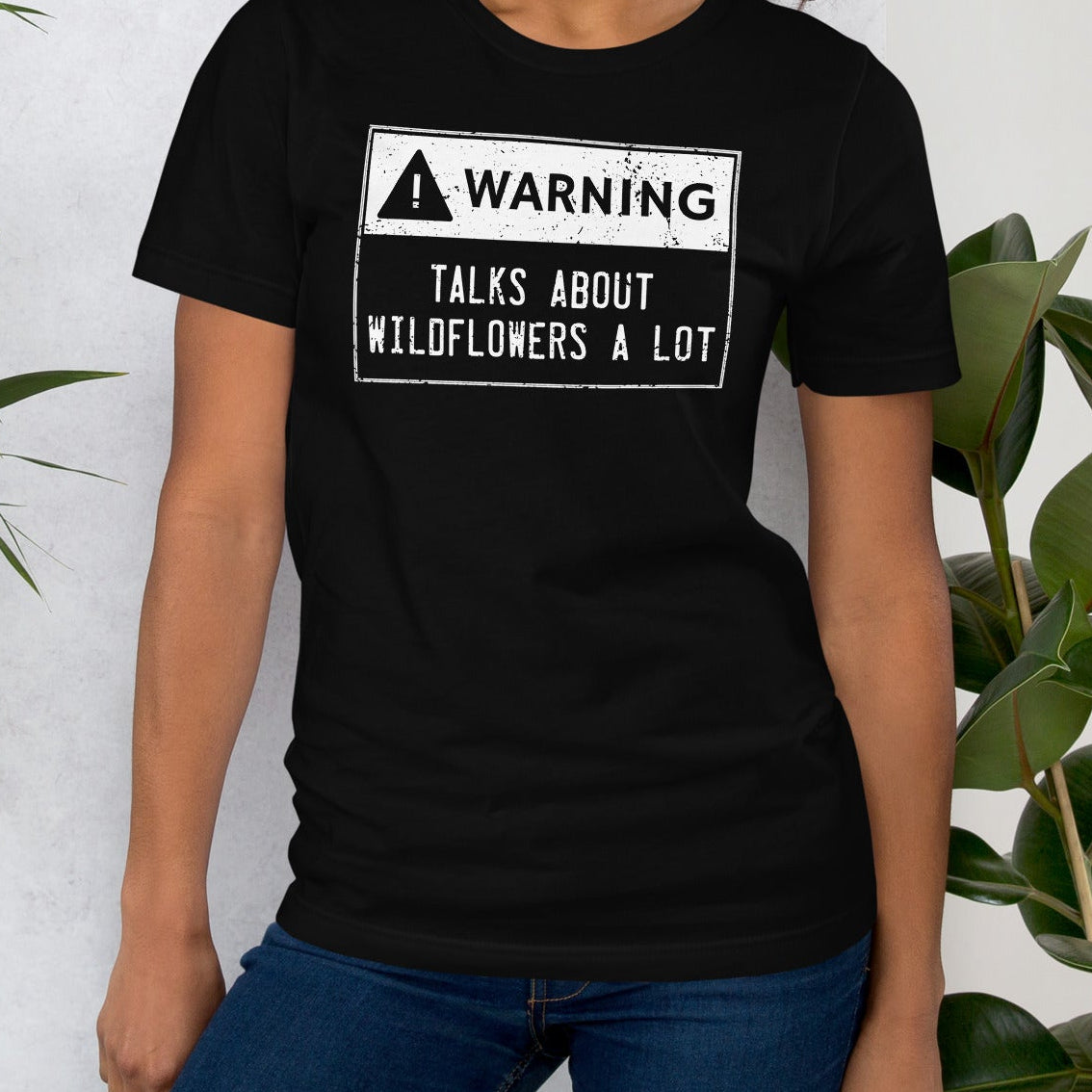 Black t-shirt with text.