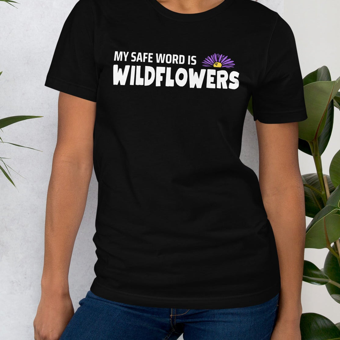 Black t-shirt with 'MY SAFE WORD IS WILDFLOWERS' text.