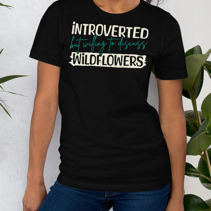 Black t-shirt with text 'introverted but willing to discuss wildflowers'.