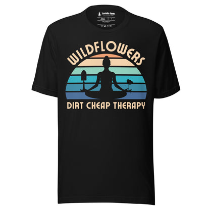 Black t-shirt with a graphic of a person meditating, wildflowers, and 'Dirt Cheap Therapy' text.