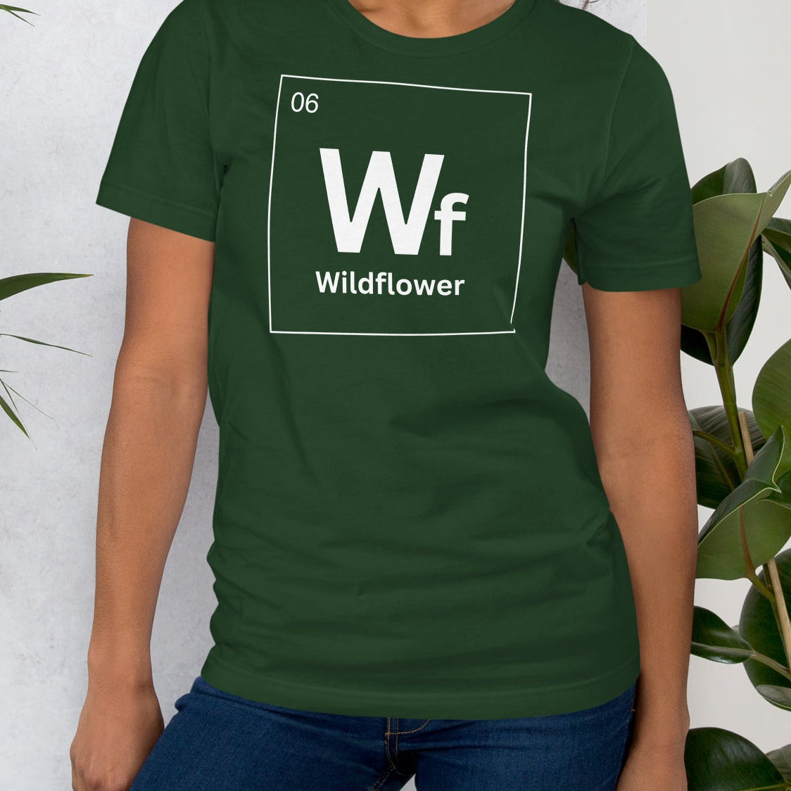 Forest green t-shirt with periodic element table 'Wildflower' text.