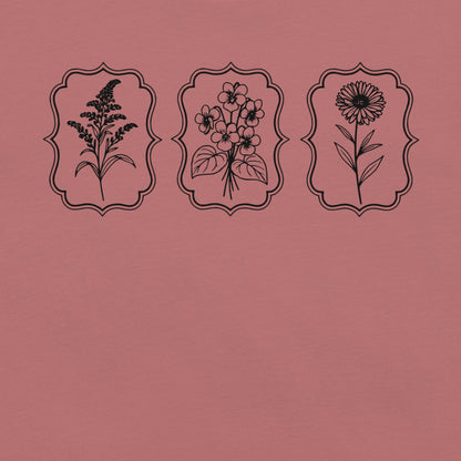 Mauve t-shirt with wildflower designs.