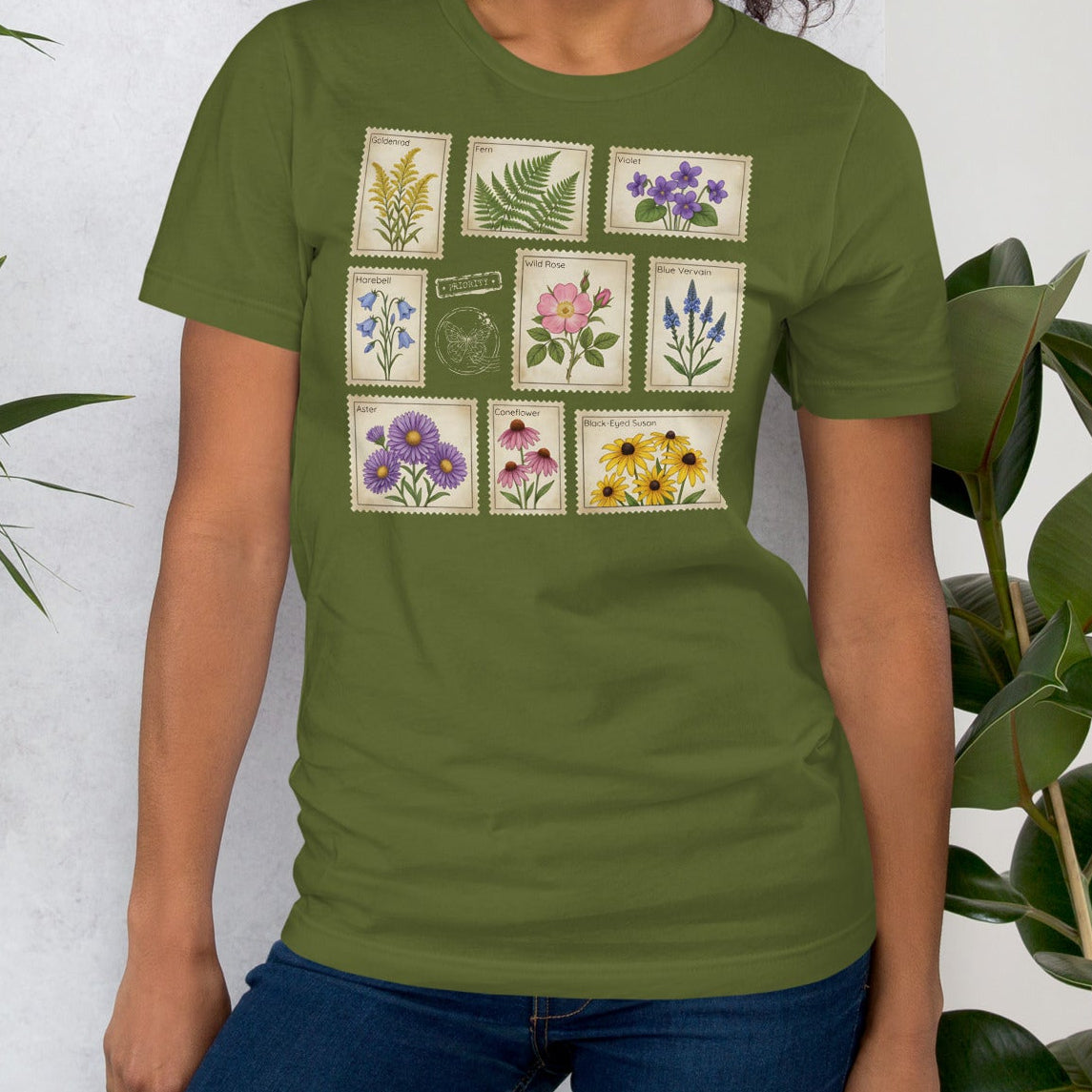 Olive green t-shirt with wildflower stamps graphic.