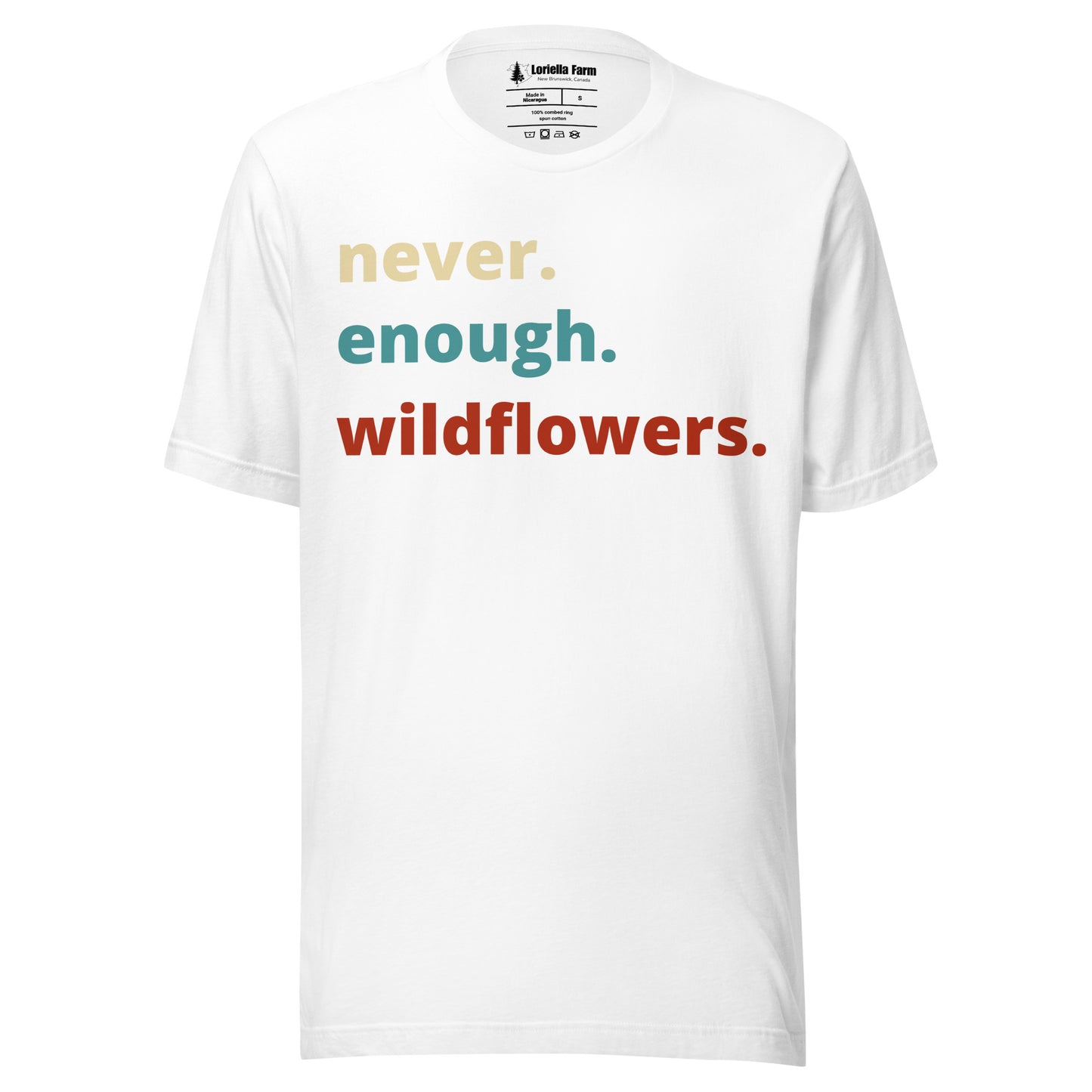 White t-shirt with colorful text 'never. enough. wildflowers.' 