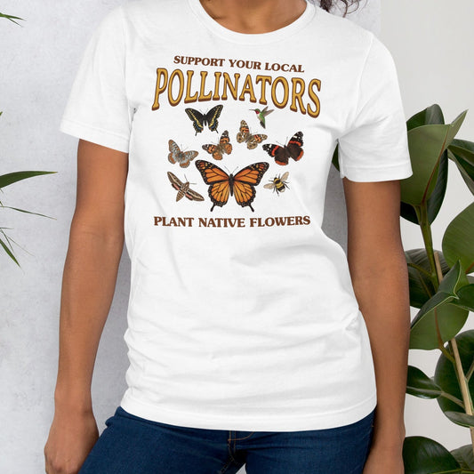 White t-shirt with butterfly design and text about pollinators and native flowers.