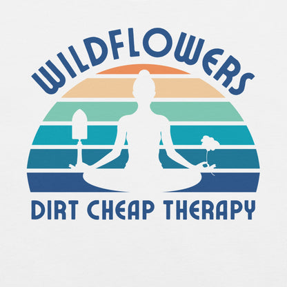 White t-shirt with a graphic of a person meditating, wildflowers, and 'Dirt Cheap Therapy' text.