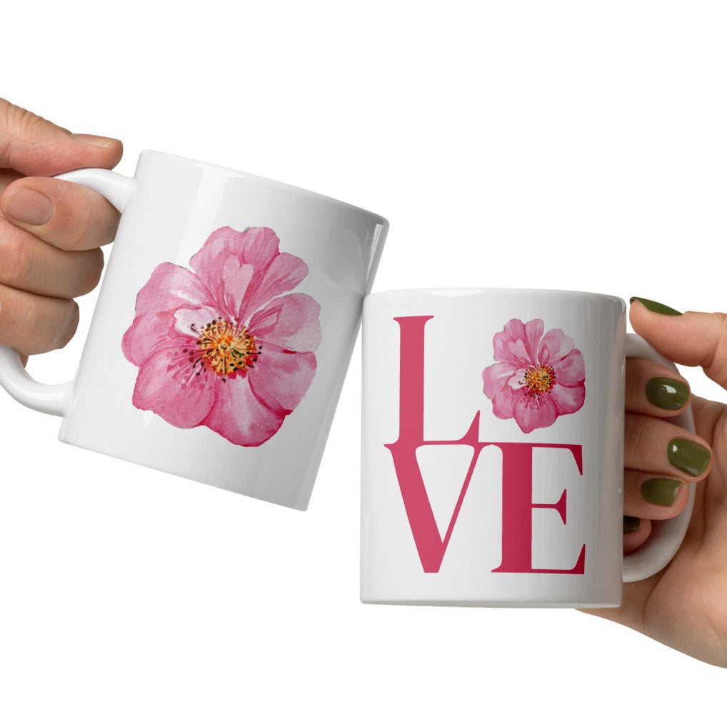 White mugs with floral and 'LOVE' design.